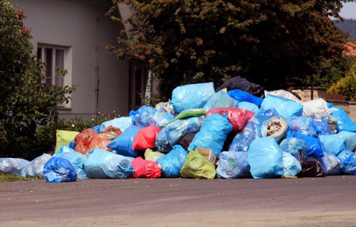 Workers sorting commercial recyclables at a depot